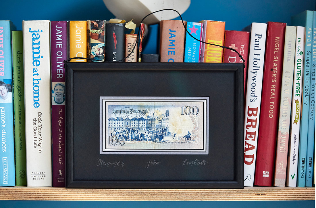 Banknote framed to be seen from both front and back.