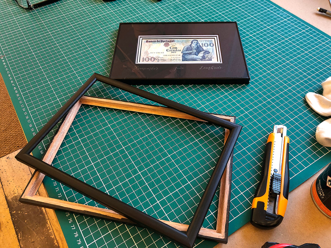 Black tape added to the mount and glass package ready to frame.